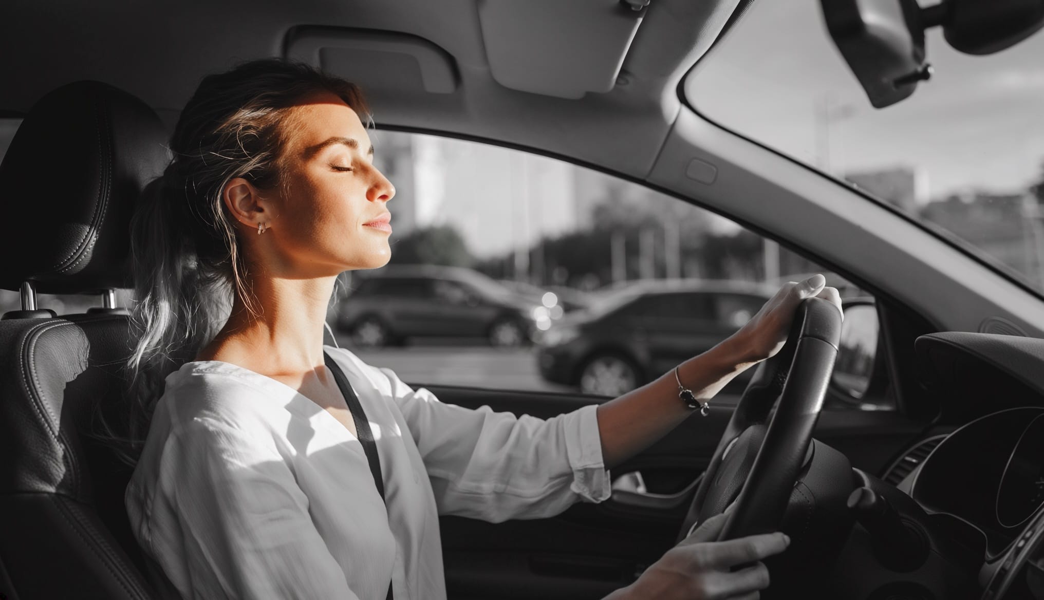 Woman finding calm moment while driving